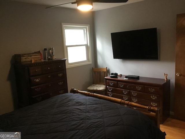 bedroom featuring light hardwood / wood-style flooring and ceiling fan