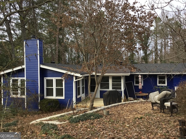 view of front of house featuring a sunroom