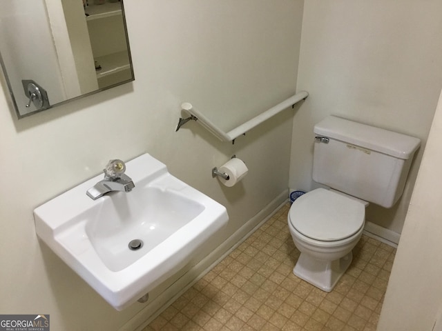 bathroom with sink and toilet