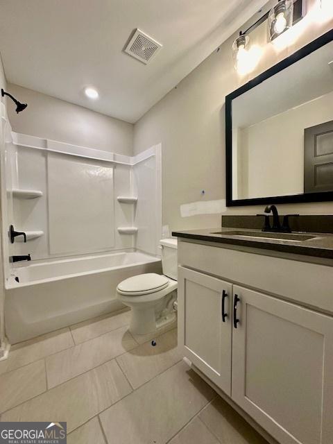 bathroom with toilet, vanity, shower / washtub combination, tile patterned flooring, and recessed lighting