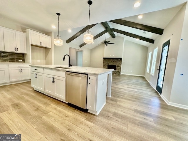 kitchen with sink, dishwasher, white cabinets, and ceiling fan