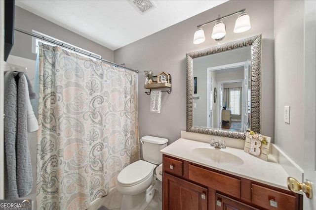 bathroom with vanity and toilet