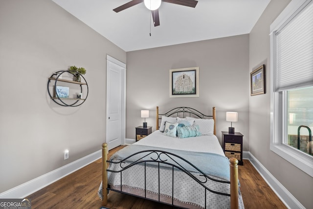 bedroom featuring ceiling fan and dark hardwood / wood-style flooring