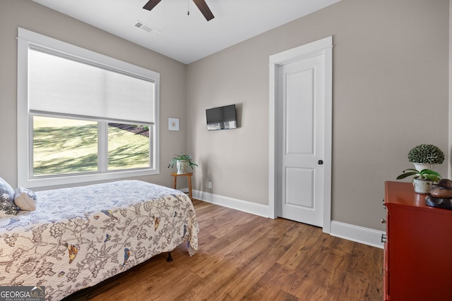 bedroom featuring wood-type flooring and ceiling fan