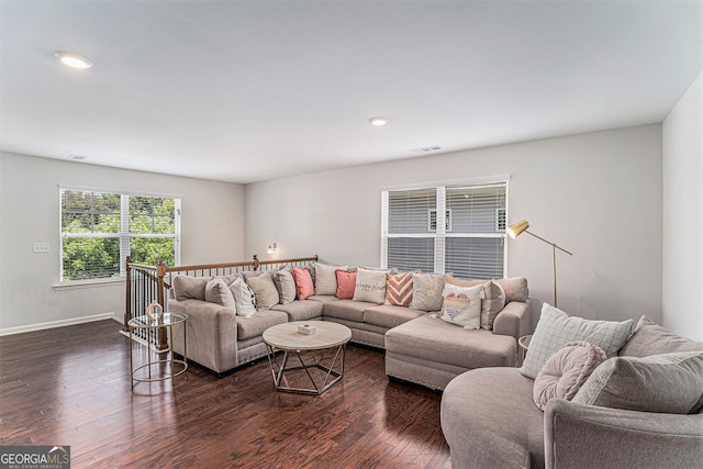 living room featuring dark wood-type flooring