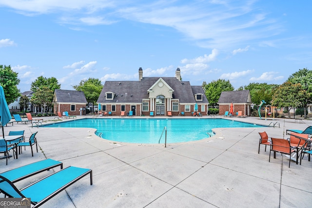 view of swimming pool with a patio area