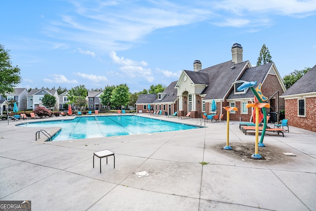 view of swimming pool with a patio area