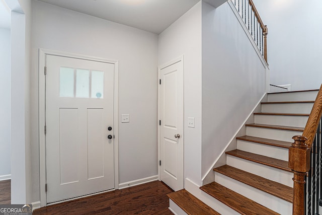 foyer entrance with dark wood-type flooring