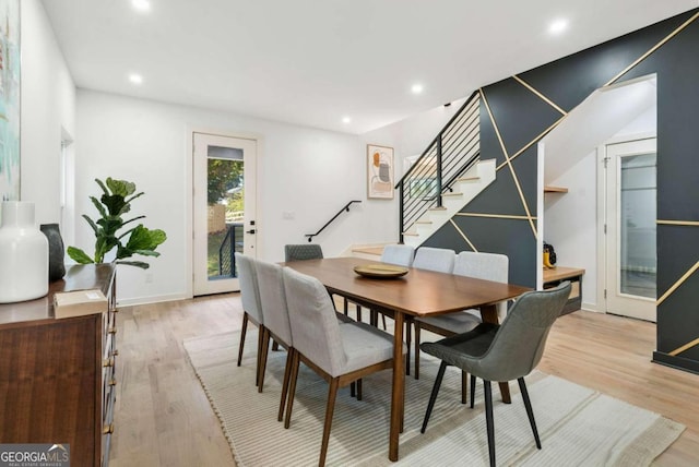 dining space featuring light wood-type flooring