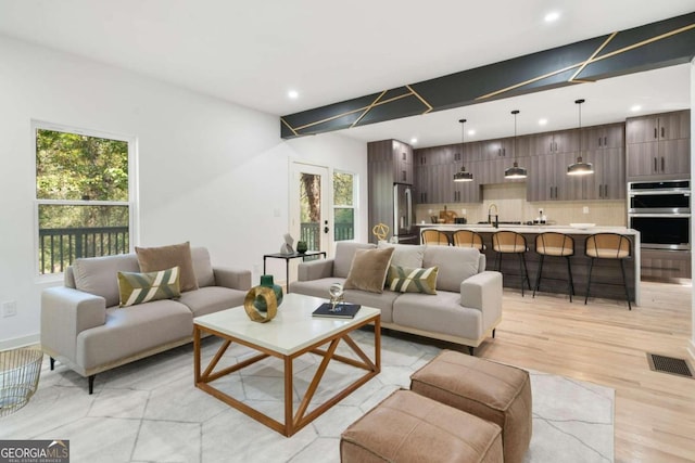 living room with light hardwood / wood-style flooring