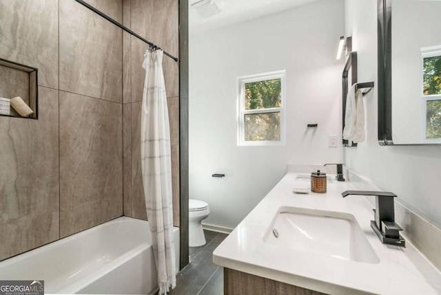 full bathroom featuring vanity, toilet, tile patterned floors, and shower / bath combo with shower curtain