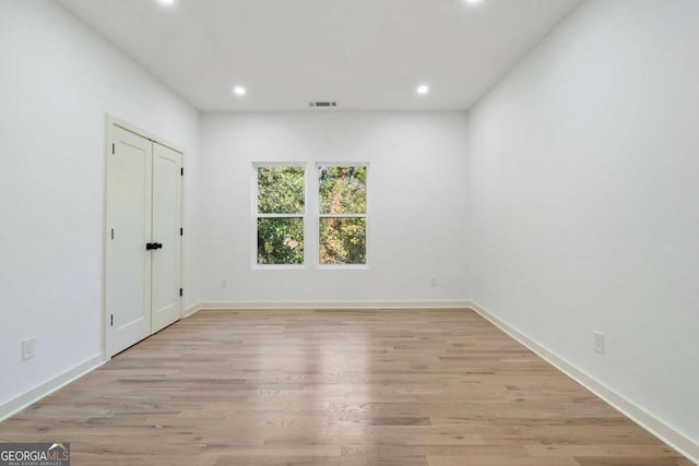 unfurnished room featuring light hardwood / wood-style flooring