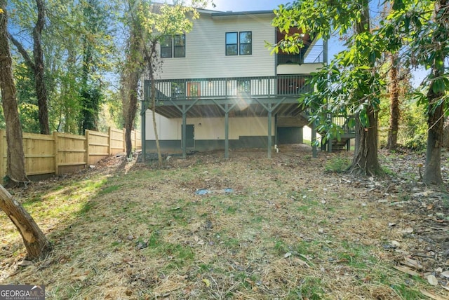 back of property with a deck