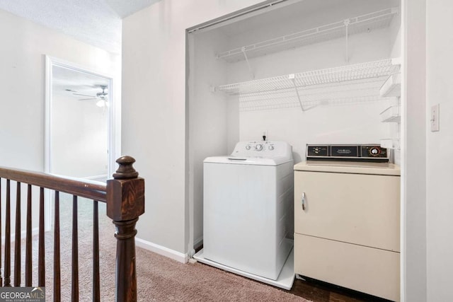 washroom featuring dark carpet, independent washer and dryer, and ceiling fan