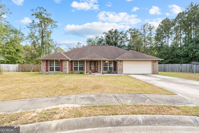 single story home with a front yard and a garage