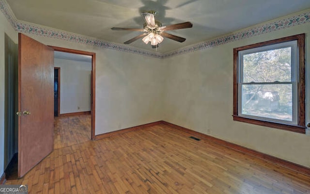 unfurnished room with light hardwood / wood-style flooring and ceiling fan