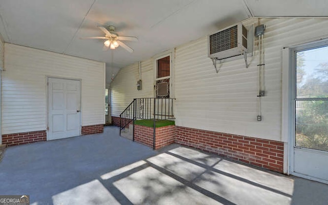 view of patio featuring ceiling fan and a wall mounted AC