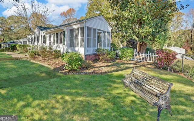 exterior space featuring a sunroom