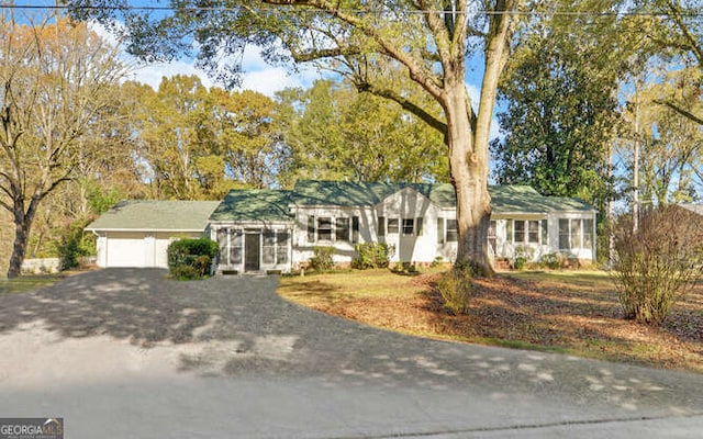 ranch-style home with a garage