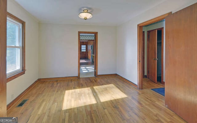 spare room featuring light hardwood / wood-style floors