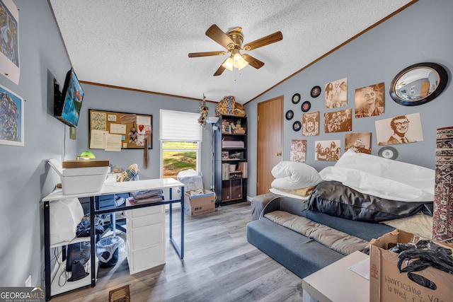 bedroom featuring crown molding, wood-type flooring, a textured ceiling, and ceiling fan