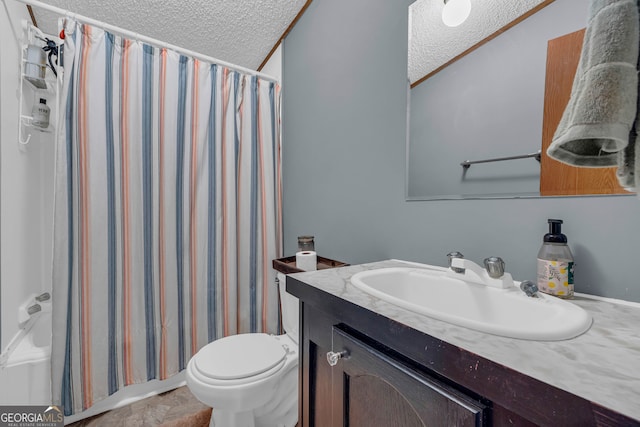 bathroom featuring vanity, crown molding, a textured ceiling, and toilet