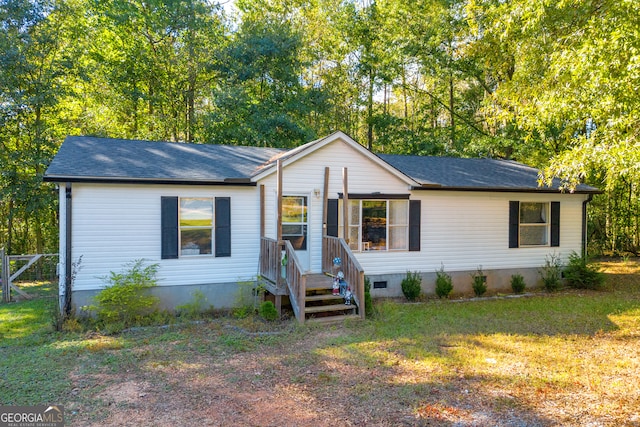 ranch-style house with a front yard