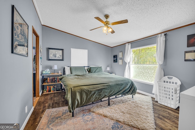 bedroom with ornamental molding, a textured ceiling, ceiling fan, and dark hardwood / wood-style flooring