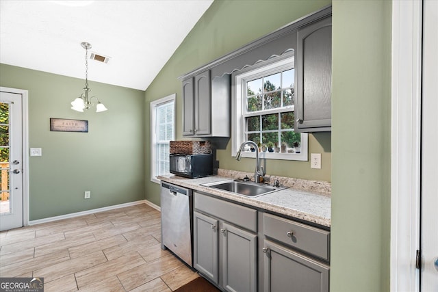 kitchen featuring black microwave, a sink, visible vents, stainless steel dishwasher, and gray cabinets