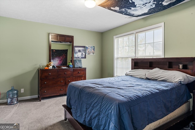 carpeted bedroom with baseboards