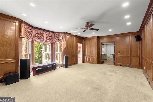 unfurnished living room featuring light carpet, ornamental molding, visible vents, and a decorative wall