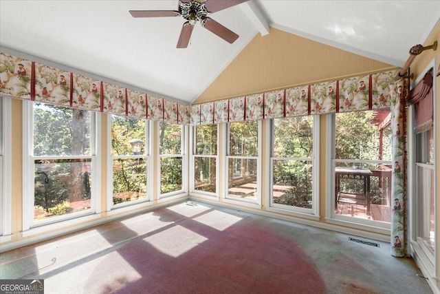 unfurnished sunroom with vaulted ceiling with beams, ceiling fan, plenty of natural light, and visible vents