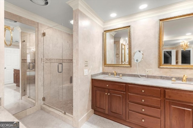 bathroom featuring crown molding, a sink, and a shower stall