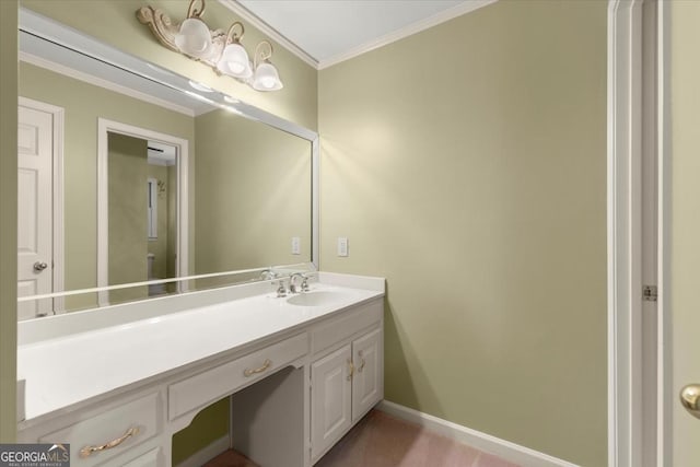 bathroom with crown molding, vanity, and baseboards