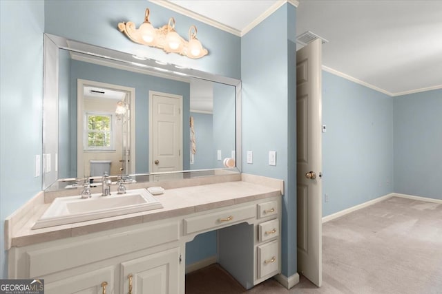 bathroom with visible vents, crown molding, vanity, and baseboards