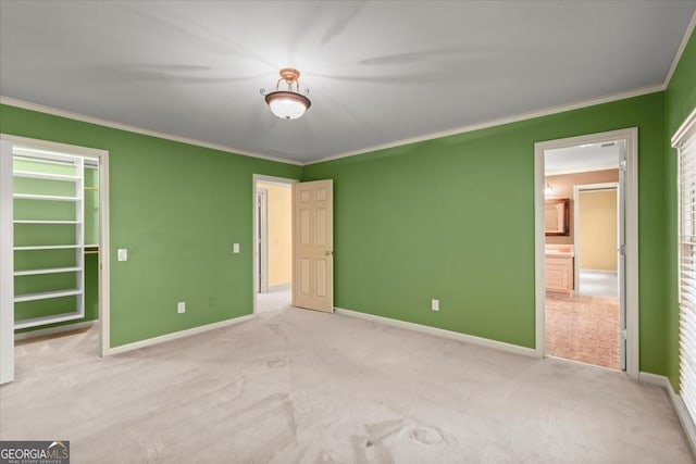 unfurnished bedroom featuring ornamental molding, carpet floors, and baseboards