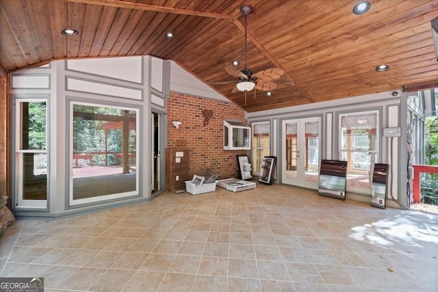 interior space featuring a wealth of natural light, lofted ceiling, wood ceiling, and french doors