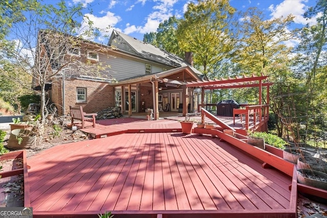 deck with french doors and area for grilling