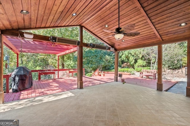 view of patio featuring a ceiling fan, a wooden deck, and area for grilling