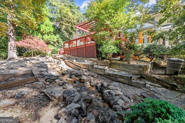 view of yard with a wooden deck