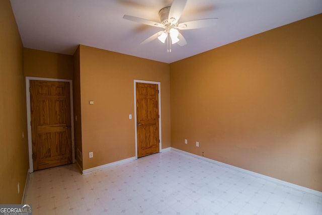 unfurnished bedroom with baseboards, ceiling fan, and light floors