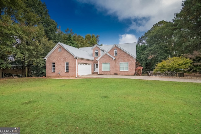 view of front facade with a garage, a front yard, concrete driveway, and brick siding