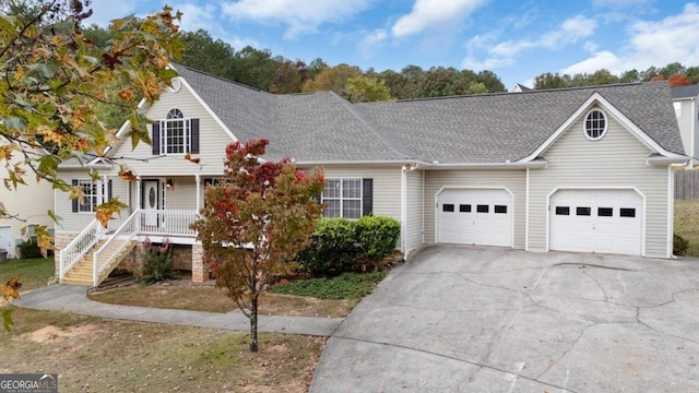 view of front facade featuring covered porch and a garage