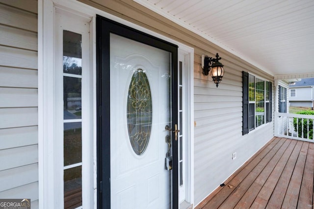 doorway to property with a porch