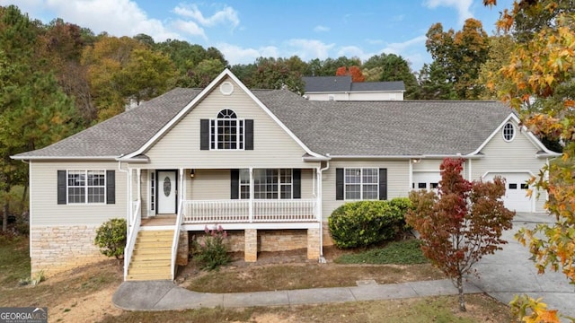 view of front of house with covered porch and a garage