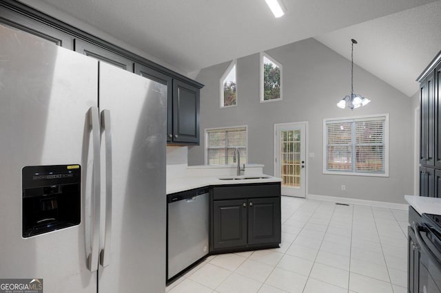 kitchen with appliances with stainless steel finishes, sink, and plenty of natural light