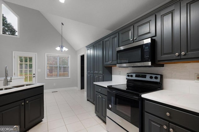 kitchen featuring sink, appliances with stainless steel finishes, hanging light fixtures, and plenty of natural light