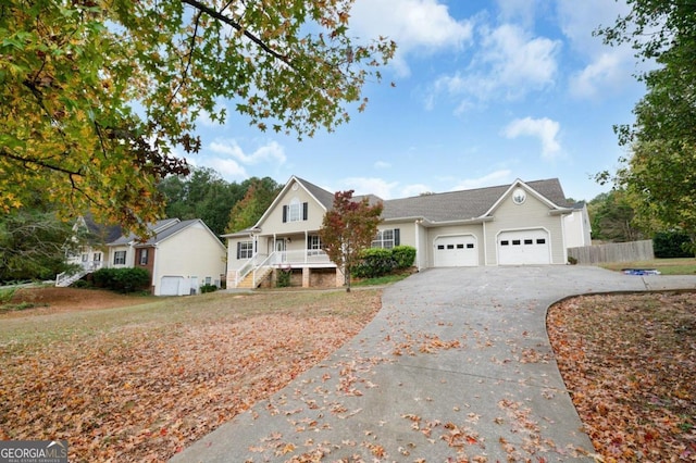 view of front facade featuring covered porch and a garage