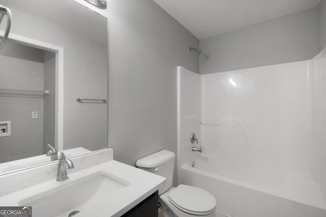 full bathroom with toilet, a textured ceiling, shower / tub combination, and vanity