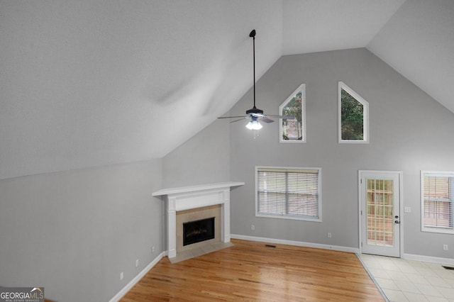 unfurnished living room with light hardwood / wood-style flooring and a healthy amount of sunlight